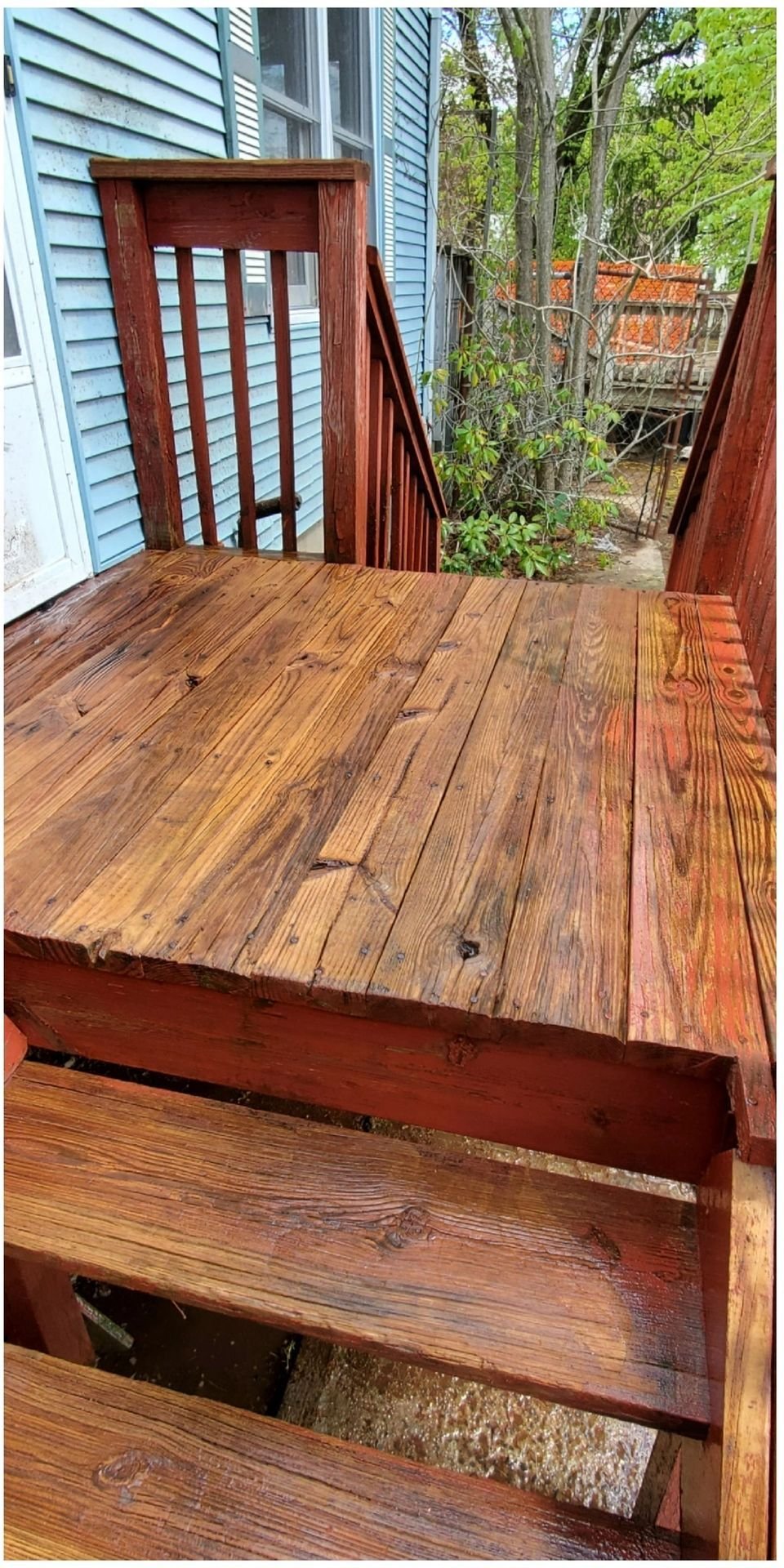 Same deck after pressure washing, wood restored to natural color