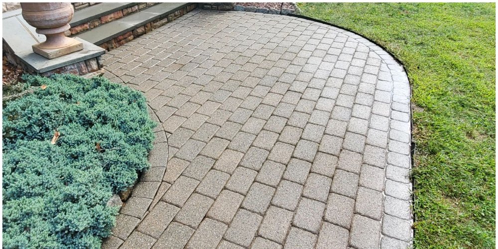 Same paver patio after pressure washing, clean and bright