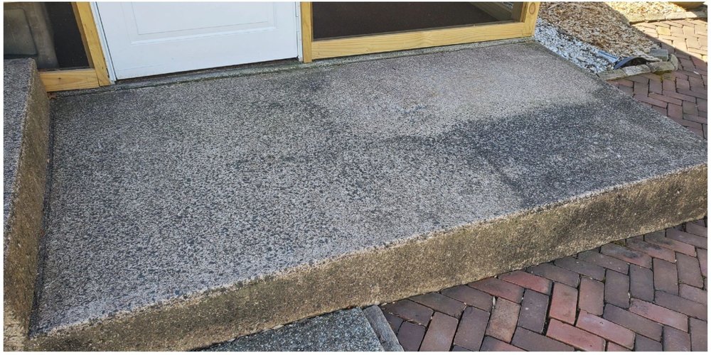 Dirty concrete steps and walkway before pressure washing